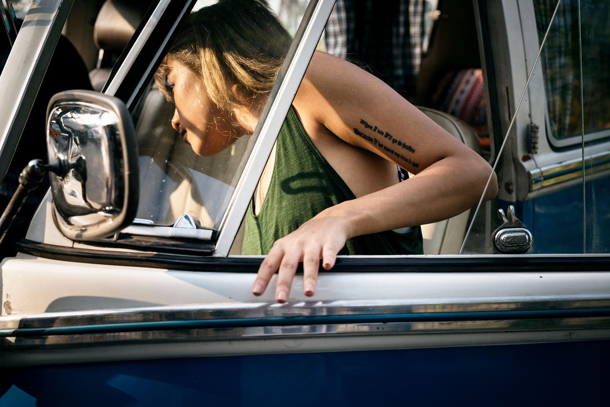 Woman Getting in a Car on Front Seat of The Car Road Trip Travel